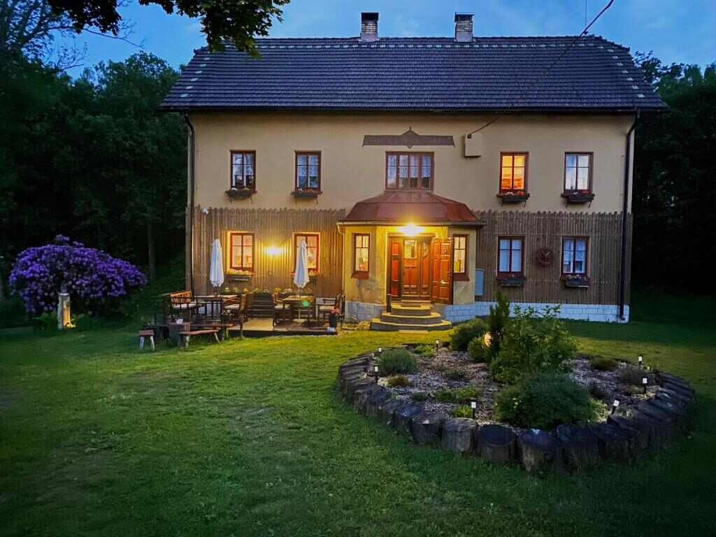 Villa Sunshine / Slunečna Vila at dusk with a lit garden